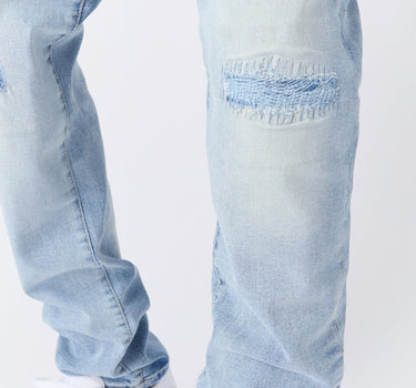 Ripped And Repaired Washed Denim Jeans - Light Blue